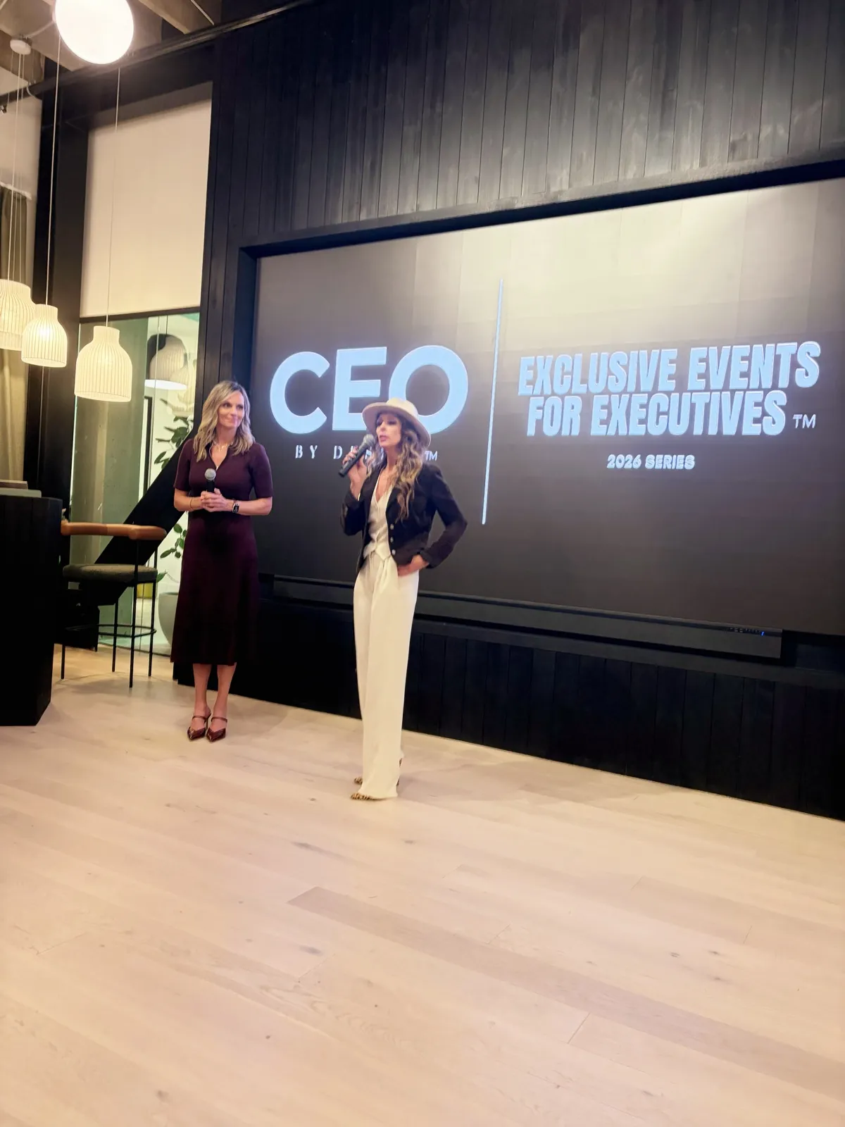 Carrie Hill delivering a keynote at an executive event